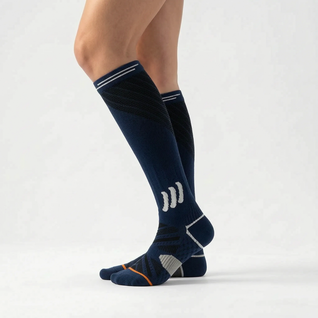 Athletic women's knee-high compression socks, offering muscle support for fitness and activewear.