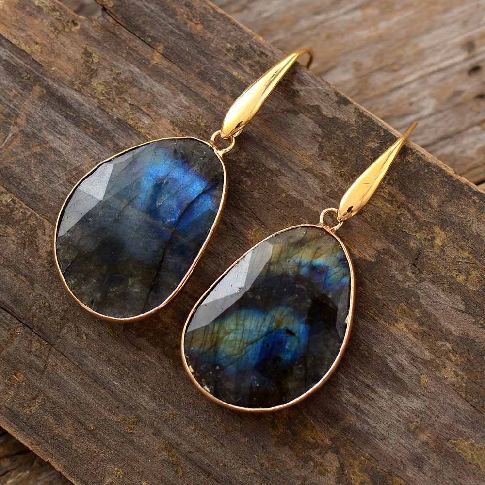 Elegant women's Labradorite drop earrings, showcasing blue-green iridescence in a mystical spiritual design.