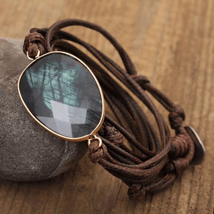 Handcrafted labradorite rope-wrap bracelet. Shimmering crystal beads & durable rope, ideal bohemian women's jewelry.