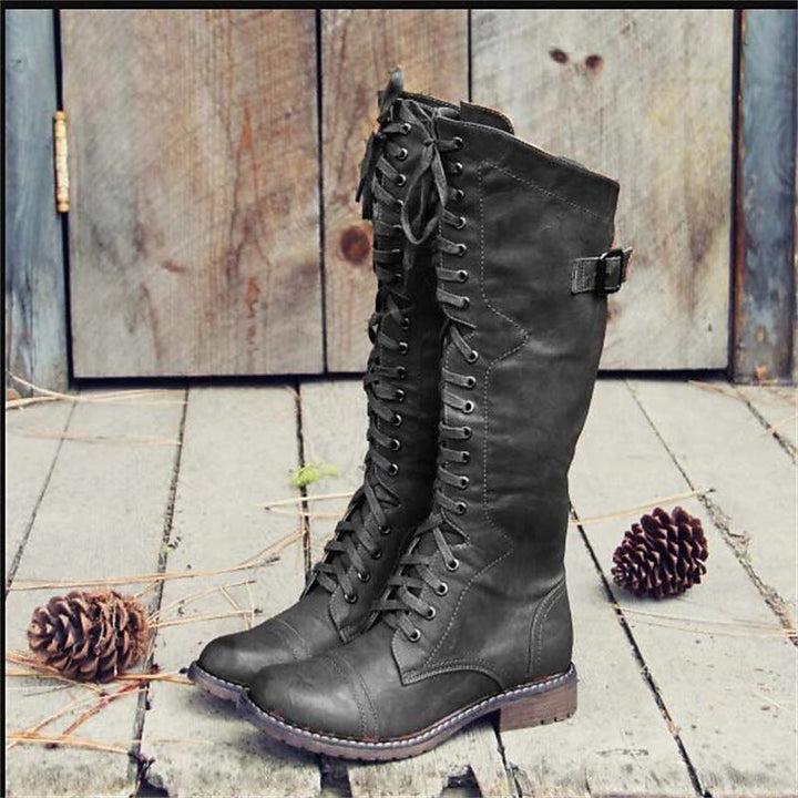 Comfortable women's knee-high riding boots with lace-up detail. Ideal for casual everyday wear in fall/winter.