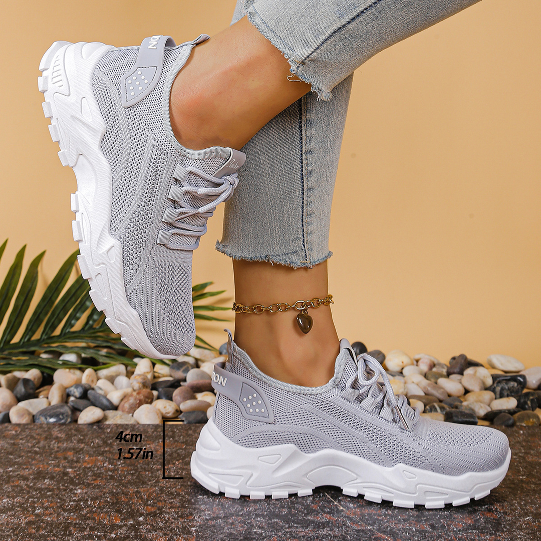 Supportive women's orthopedic walking sneakers, featuring a lace-up design for foot health and comfort.
