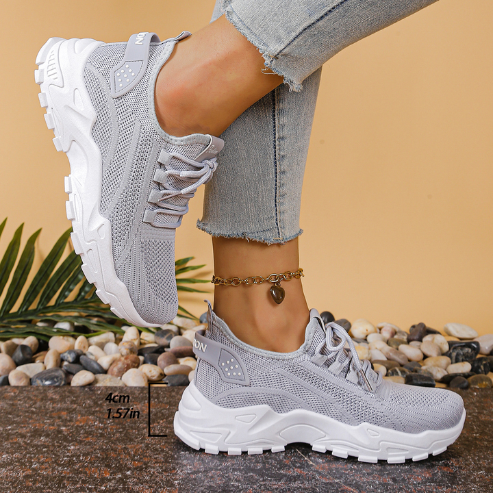 Supportive women's orthopedic walking sneakers, featuring a lace-up design for foot health and comfort.