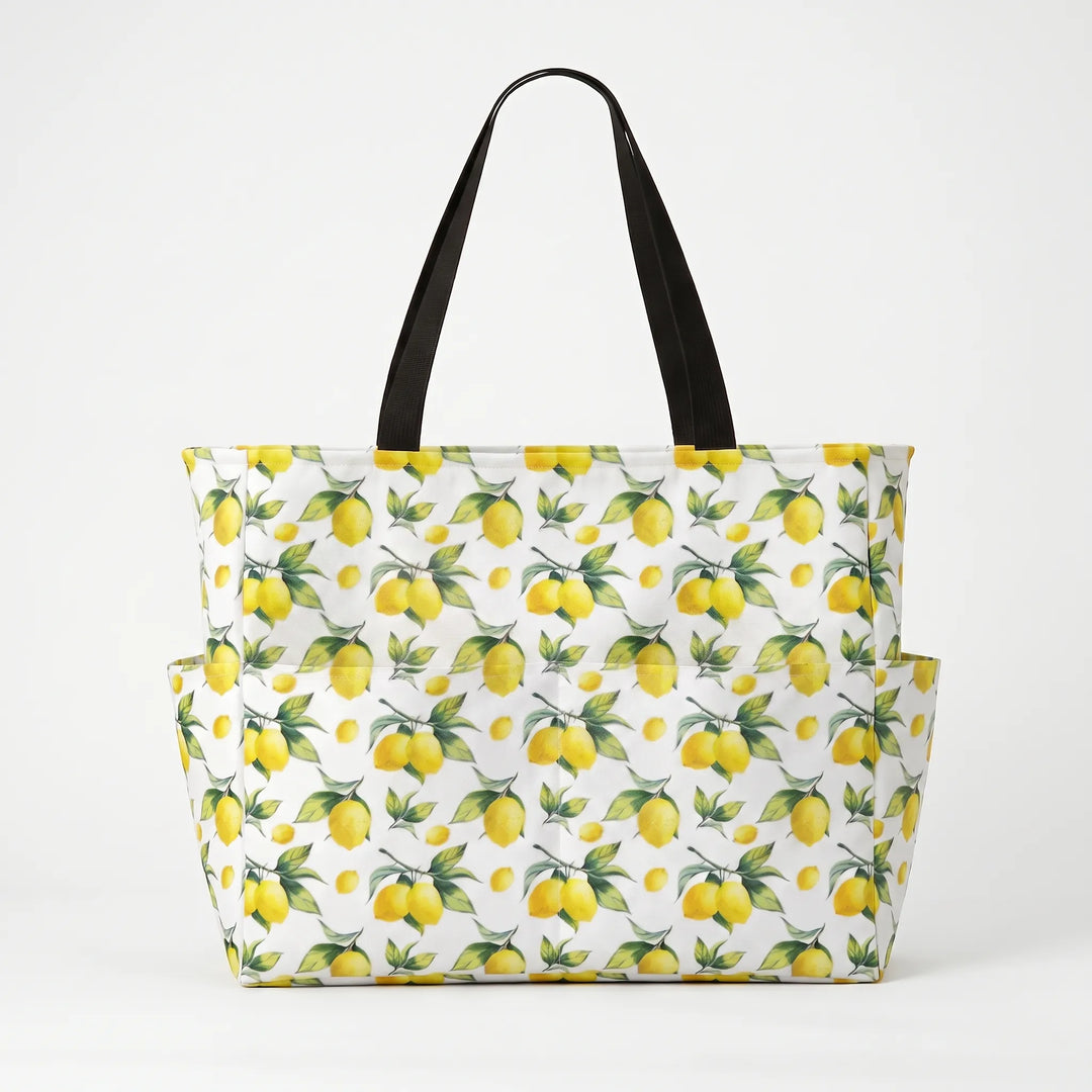 Water-resistant foldable women's large beach tote with tropical lemon print, versatile & practical.