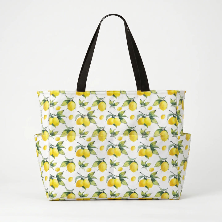 Water-resistant foldable women's large beach tote with tropical lemon print, versatile & practical.