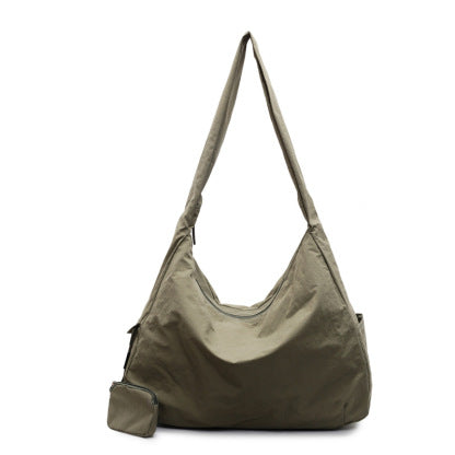 Women's versatile large hobo bag, worn as a crossbody or shoulder bag for daily chic.