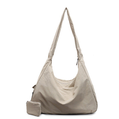 Practical women's large capacity daily bag, organized for work, travel, or casual outings.