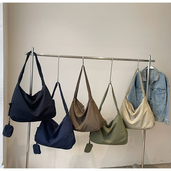 Chic large capacity hobo bag for women, an organized casual daily accessory.