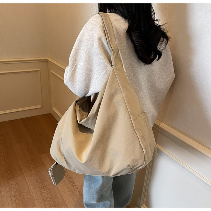 Organized women's large crossbody bag, perfect for daily carry & travel essentials.