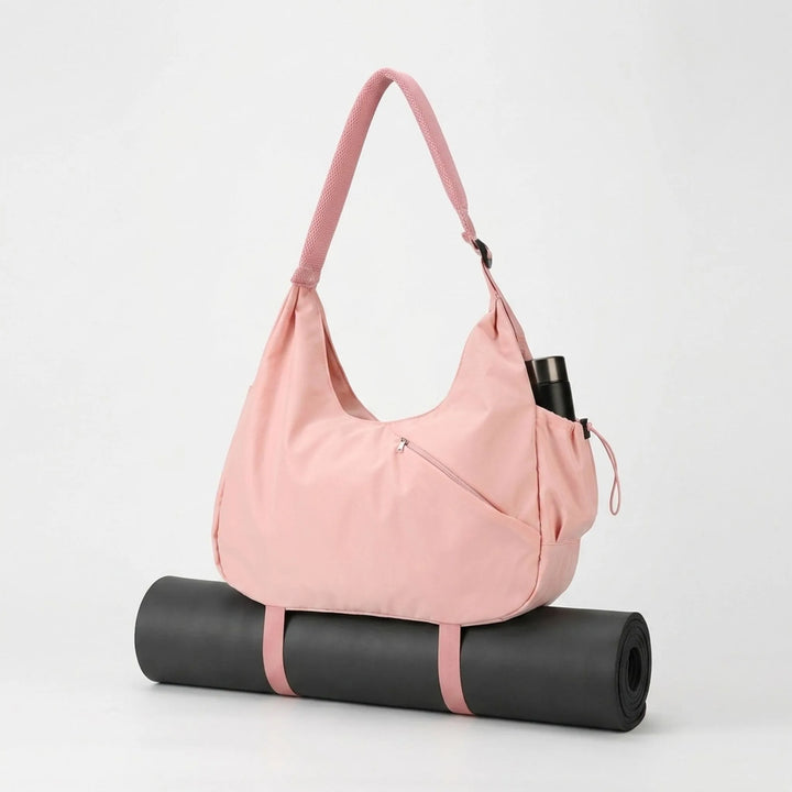 Durable women's gym bag with wet/dry pocket & yoga mat straps, ideal for workout clothes & essentials.