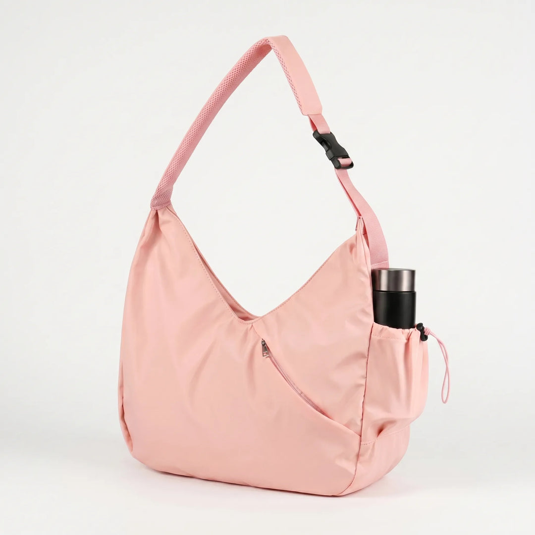 Versatile women's shoulder bag: large fitness tote with yoga mat straps, great for travel & gym workouts.
