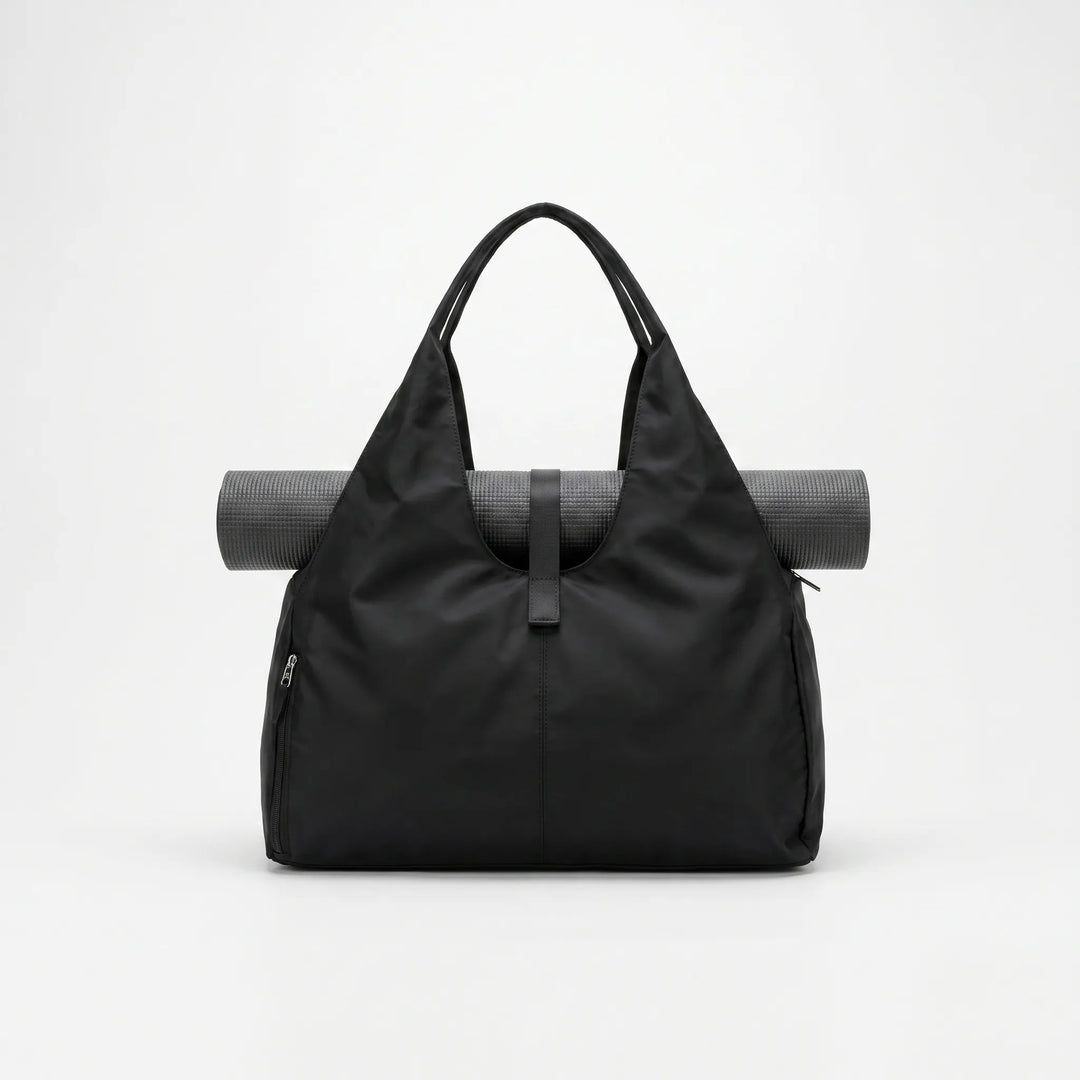 Spacious women's gym duffel bag, ideal for sports, yoga, or travel, featuring a convenient shoe compartment.
