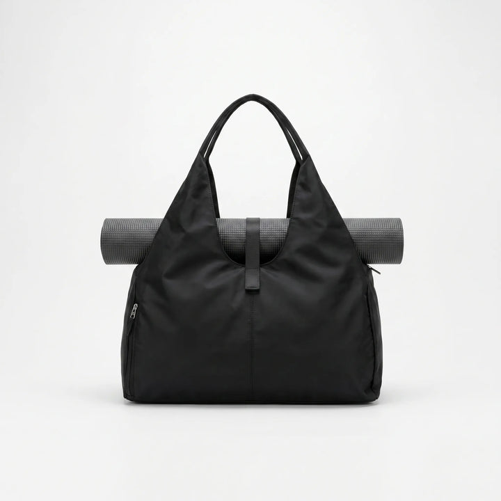 Spacious women's gym duffel bag, ideal for sports, yoga, or travel, featuring a convenient shoe compartment.