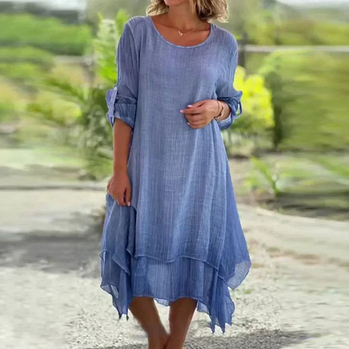 Elegant women's round neck layered midi dress with 3/4 sleeves, ideal for summer vacation.