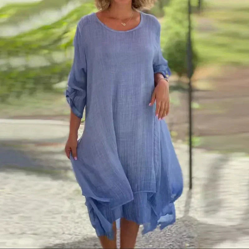 Stylish women's layered midi dress featuring 3/4 sleeves, a chic casual summer design.