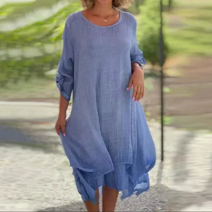 Stylish women's layered midi dress featuring 3/4 sleeves, a chic casual summer design.