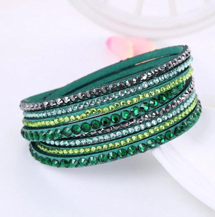 Close-up of a women's adjustable layered rhinestone wrap bracelet, showcasing sparkling details.