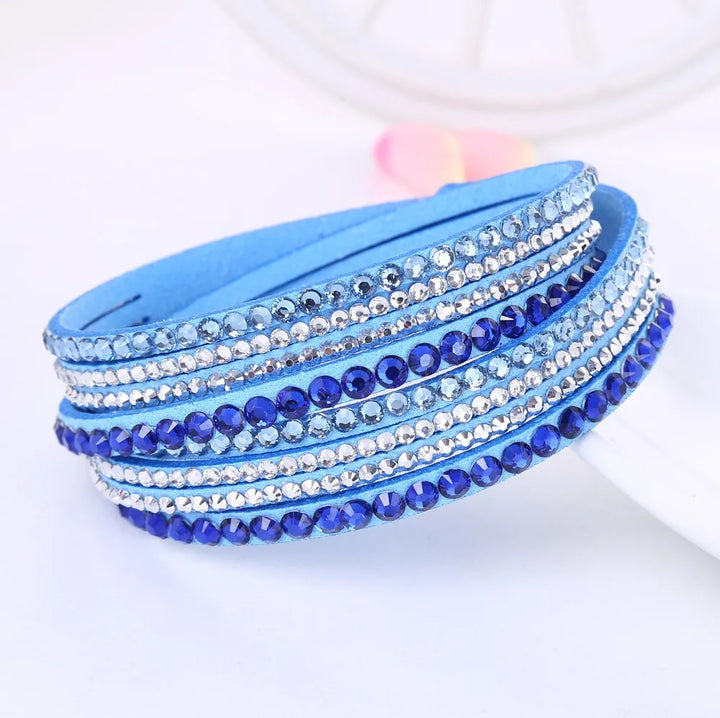 Shimmering women's layered rhinestone wrap bracelet worn on a wrist, showcasing its elegant sparkle.