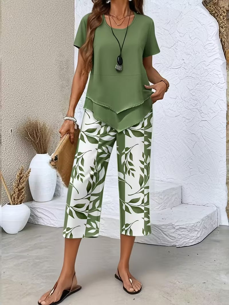 Women's leaf print 2-piece outfit with short sleeve top and comfortable cropped pants for summer casual wear.