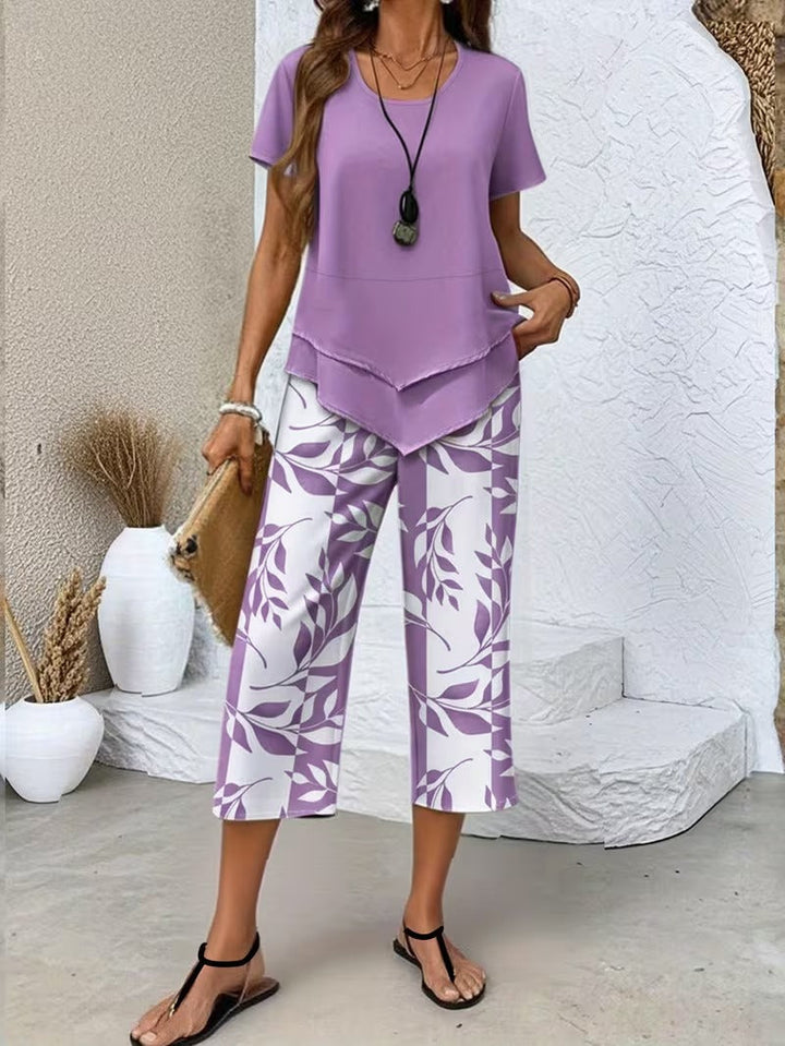 Women's short sleeve leaf print top paired with matching cropped pants, a chic 2-piece summer set.