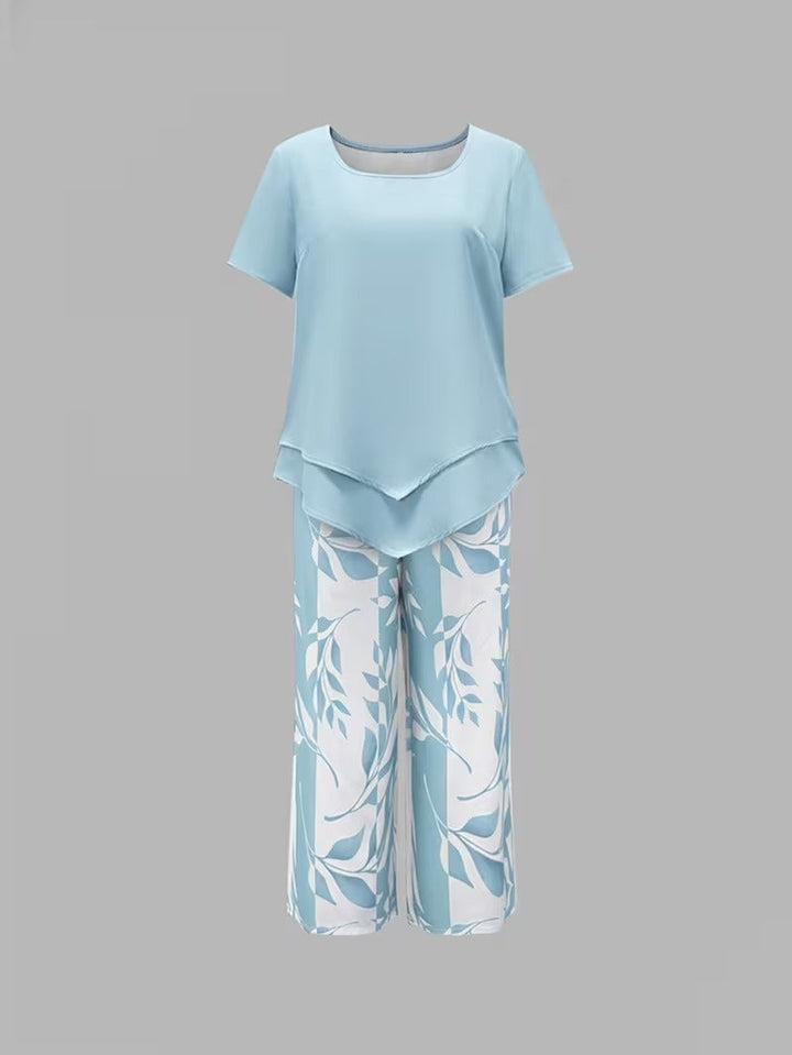 Vibrant leaf print women's 2-piece set, including a flowy short sleeve top and comfortable cropped pants.
