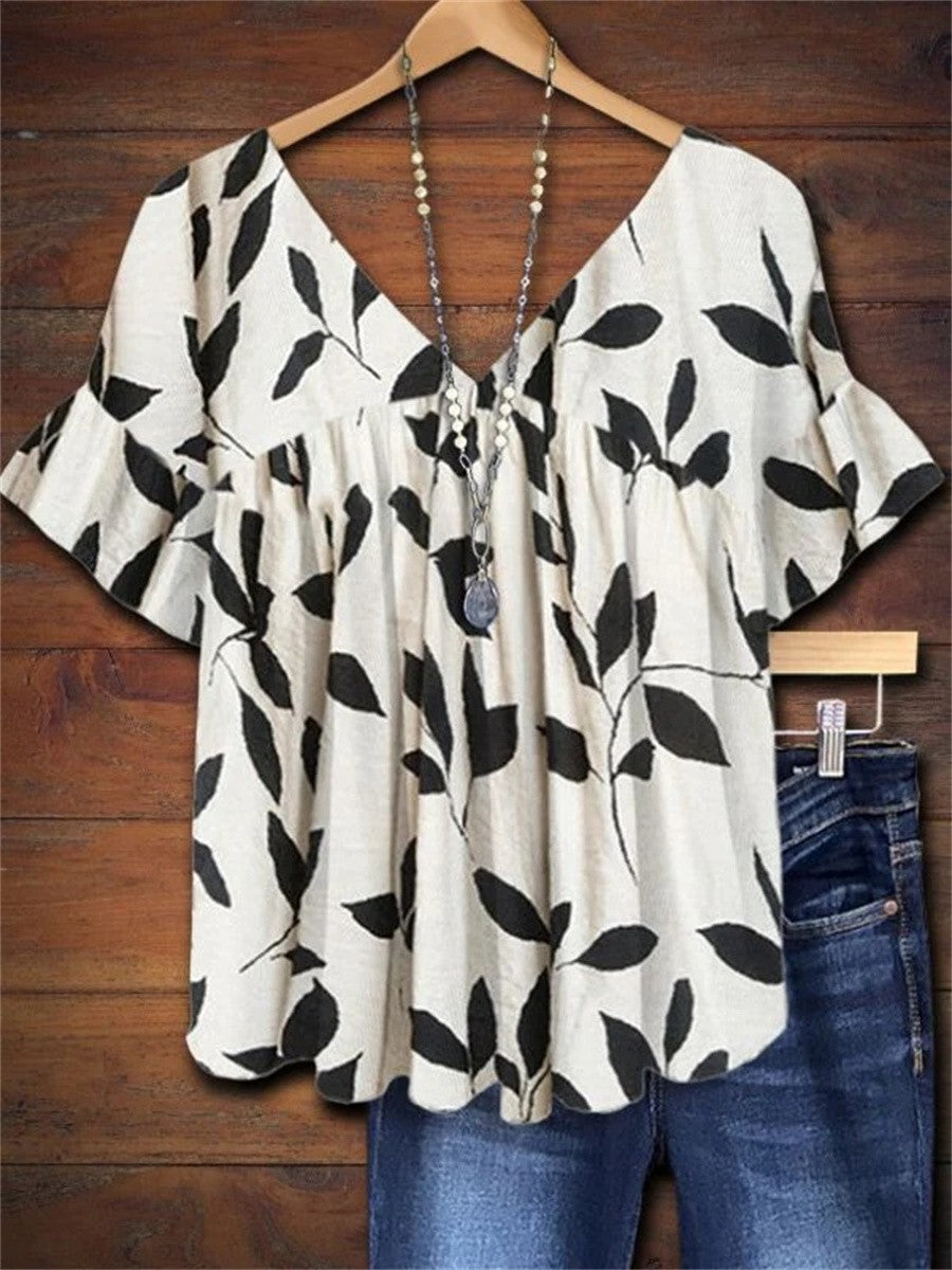 Women's leaf print smock blouse with V-neck & ruffle sleeves. Lightweight summer top for casual boho style.