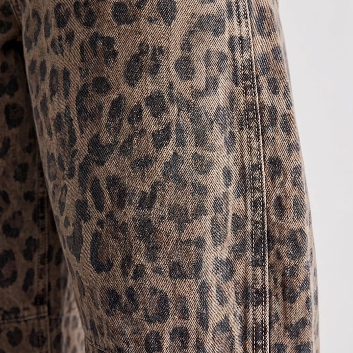 Brown leopard print barrel jeans for women, a bold statement piece with a relaxed fit and streetwear appeal.