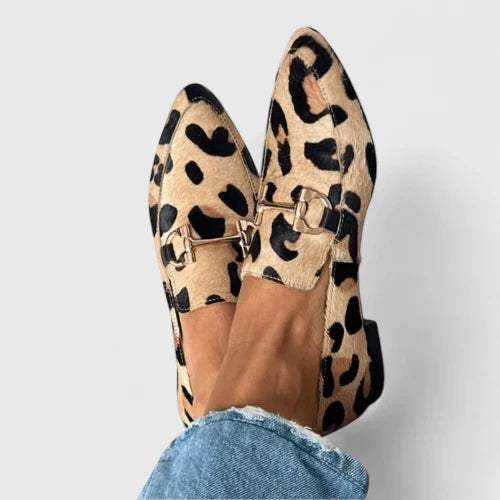 Women's leopard print pointed toe flat loafers with gold horsebit. Chic slip-on animal print fashion flats.