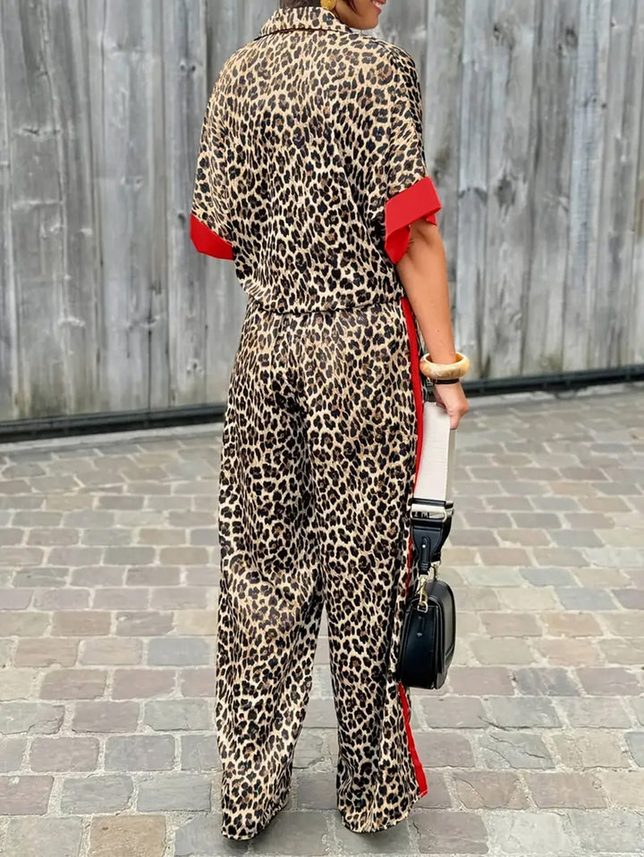 Comfortable women's short-sleeve leopard print jumpsuit, featuring wide legs & V-neck.