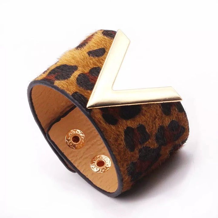 Boho chic women's adjustable wrap bracelet with bold leopard print, a statement jewelry piece.