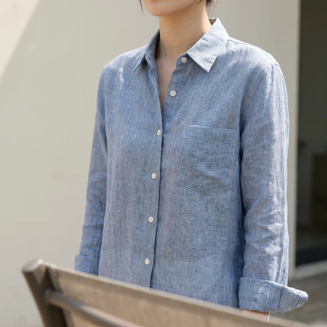 Women's lightweight button-up shirt in white, featuring a relaxed fit for effortless casual style & everyday wear.