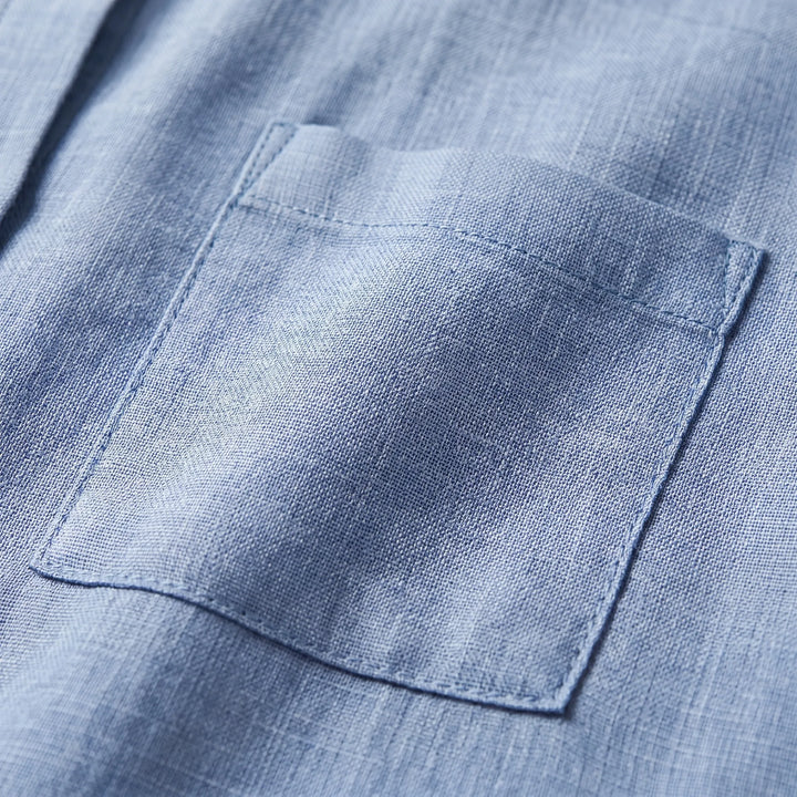 Versatile women's button-up shirt, ideal for layering or as a casual top. Lightweight & classic for any occasion.