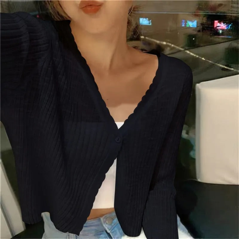 Textured view of women's cropped button cardigan, lightweight & comfortable for casual or everyday wear.