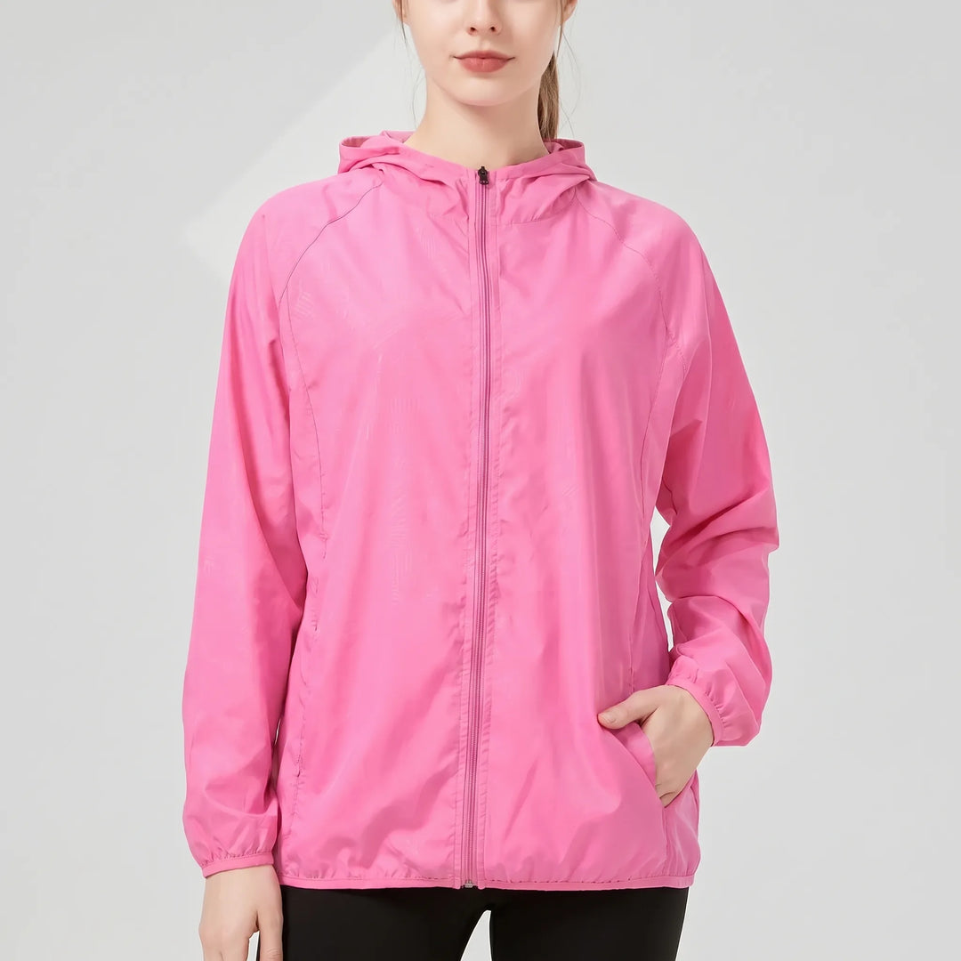 Packable women's windbreaker rain jacket, ideal for spring & fall athletic wear.