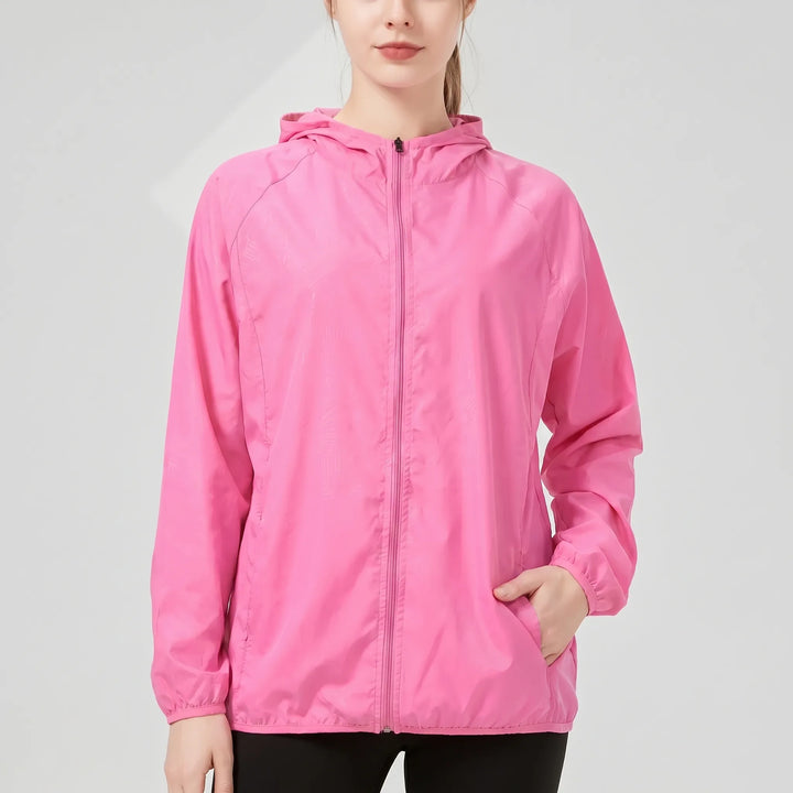 Packable women's windbreaker rain jacket, ideal for spring & fall athletic wear.