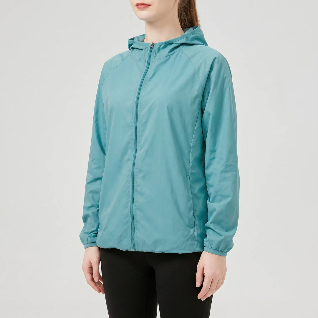 Versatile women's windbreaker, a lightweight hooded jacket for active spring/fall days.