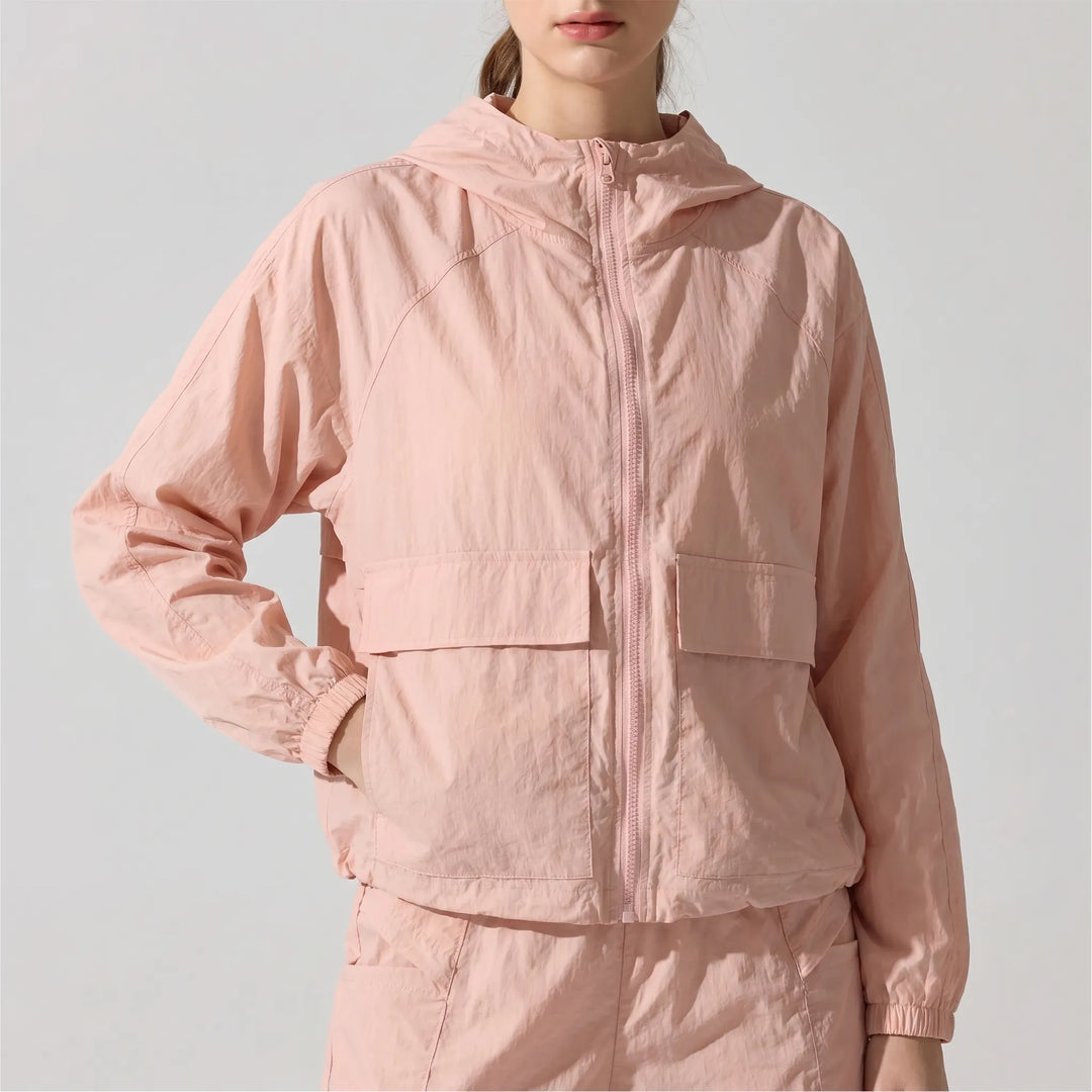 Athletic women's hooded jacket, lightweight & breathable, perfect for spring/fall running & workouts.