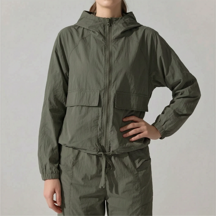 Model wearing a comfortable women's lightweight hooded workout jacket. Perfect for gym & outdoor sports.
