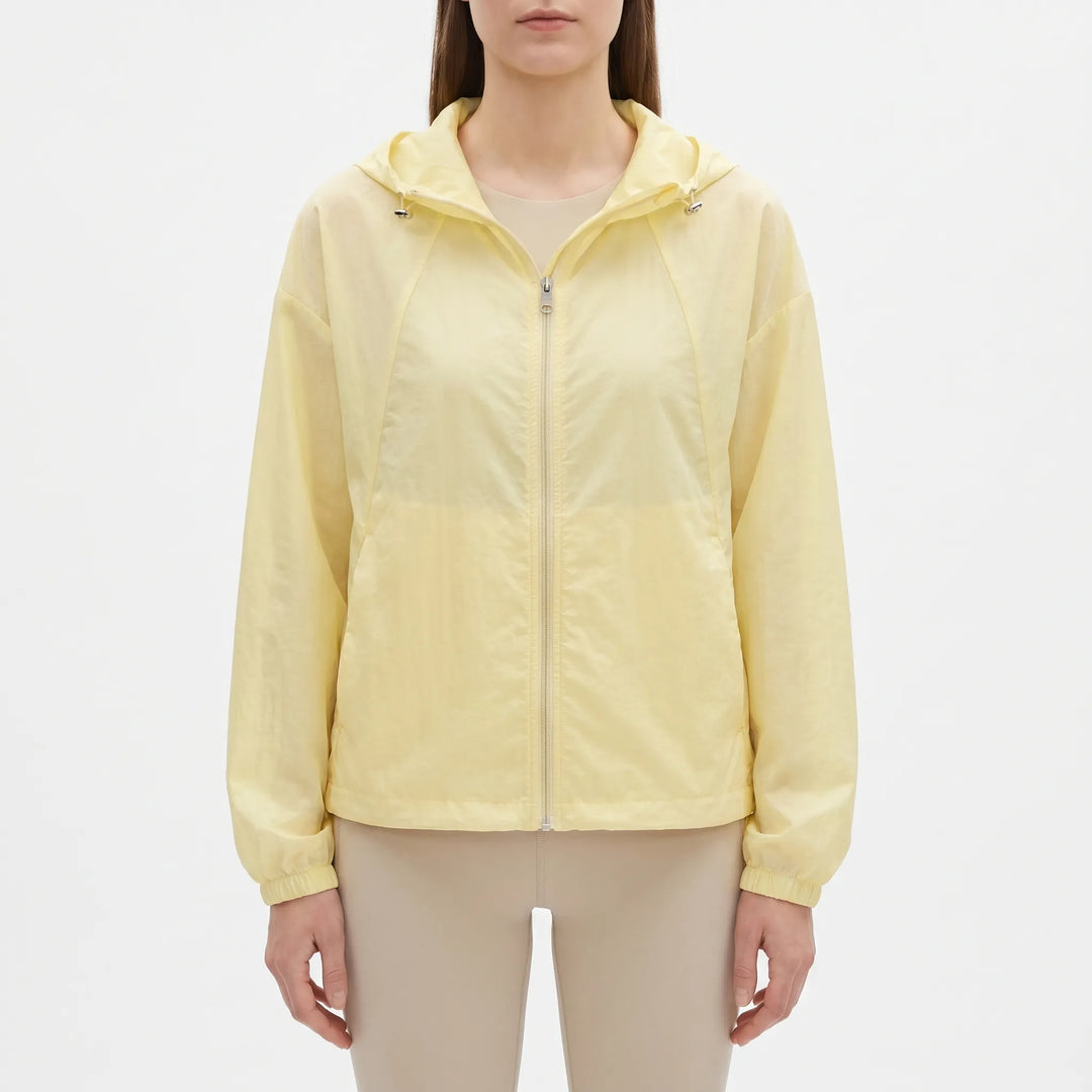 Stylish women's spring/summer hooded windbreaker, perfect lightweight jacket for casual outdoor activities.