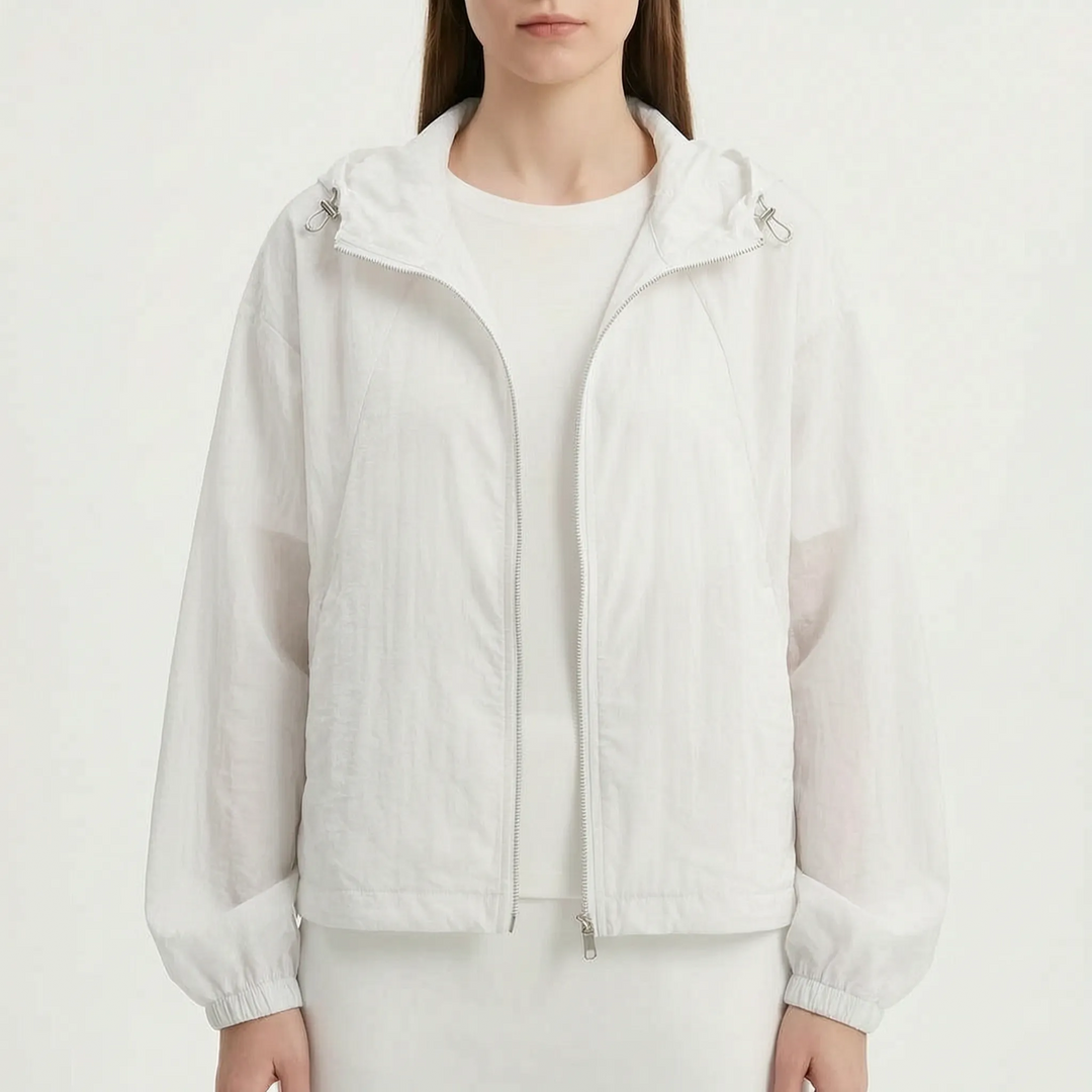 Protective women's lightweight hooded windbreaker jacket, ideal for shielding against wind and light rain.