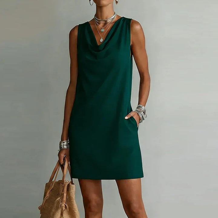 Women's lightweight mini dress with pockets, perfect for summer casual wear. Relaxed fit sleeveless design.