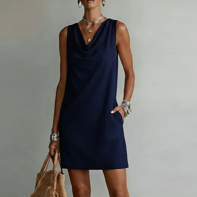 Sleeveless summer mini dress for women, ideal for vacation or beach. Features a relaxed fit and handy pockets.