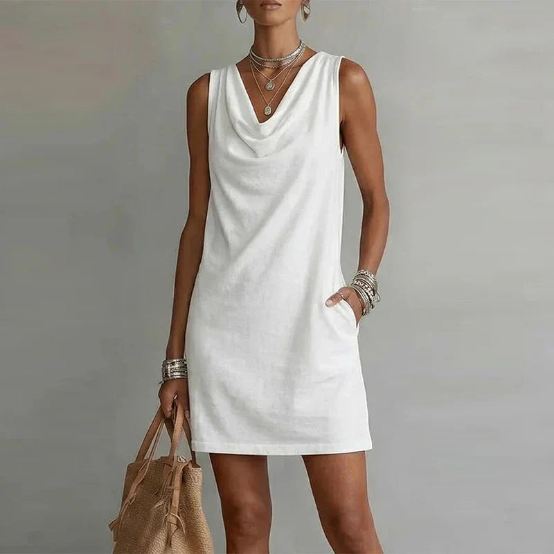 Lightweight women's pocket mini dress, a casual summer essential. Sleeveless design offers ultimate warm weather comfort.
