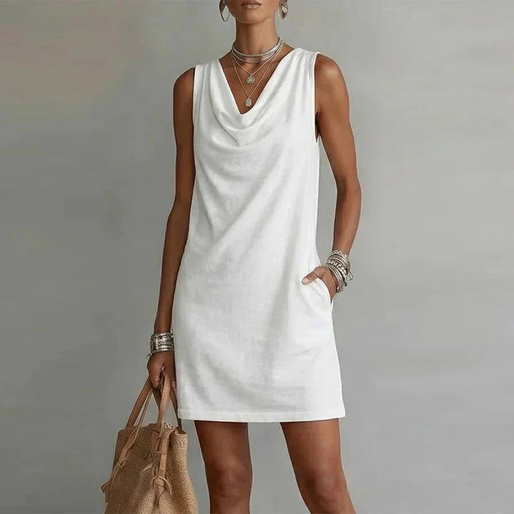 Lightweight women's pocket mini dress, a casual summer essential. Sleeveless design offers ultimate warm weather comfort.