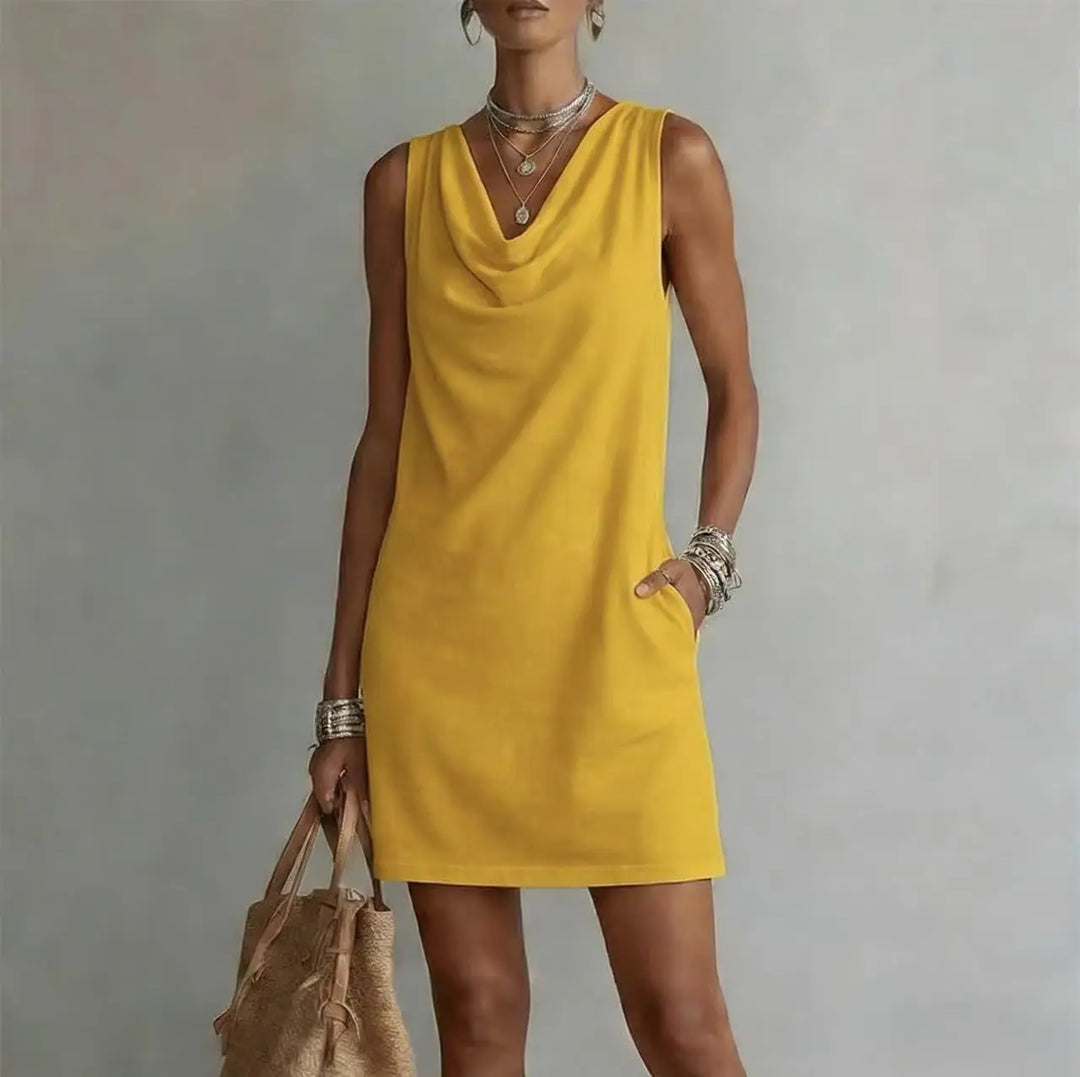 Versatile women's mini dress with pockets, suitable for everyday wear or vacation. Lightweight, relaxed fit, sleeveless.