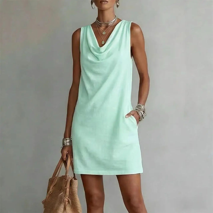 Women's beach mini dress, lightweight and perfect for warm weather. Features a relaxed fit, sleeveless design, and pockets.
