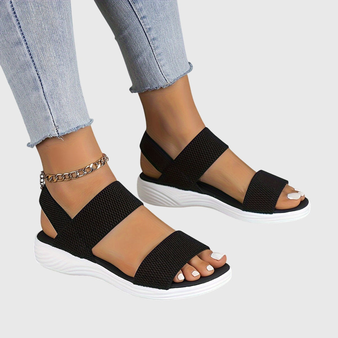 Comfortable women's sandals featuring adjustable straps & superior arch support for daily wear.