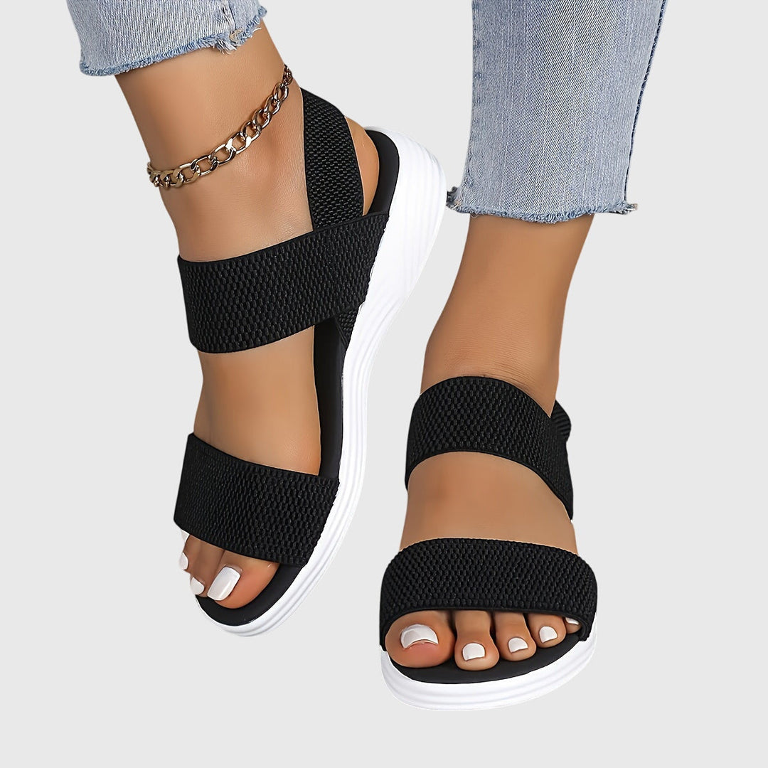 Lightweight women's walking sandals, designed with adjustable arch support and comfortable cushioning.