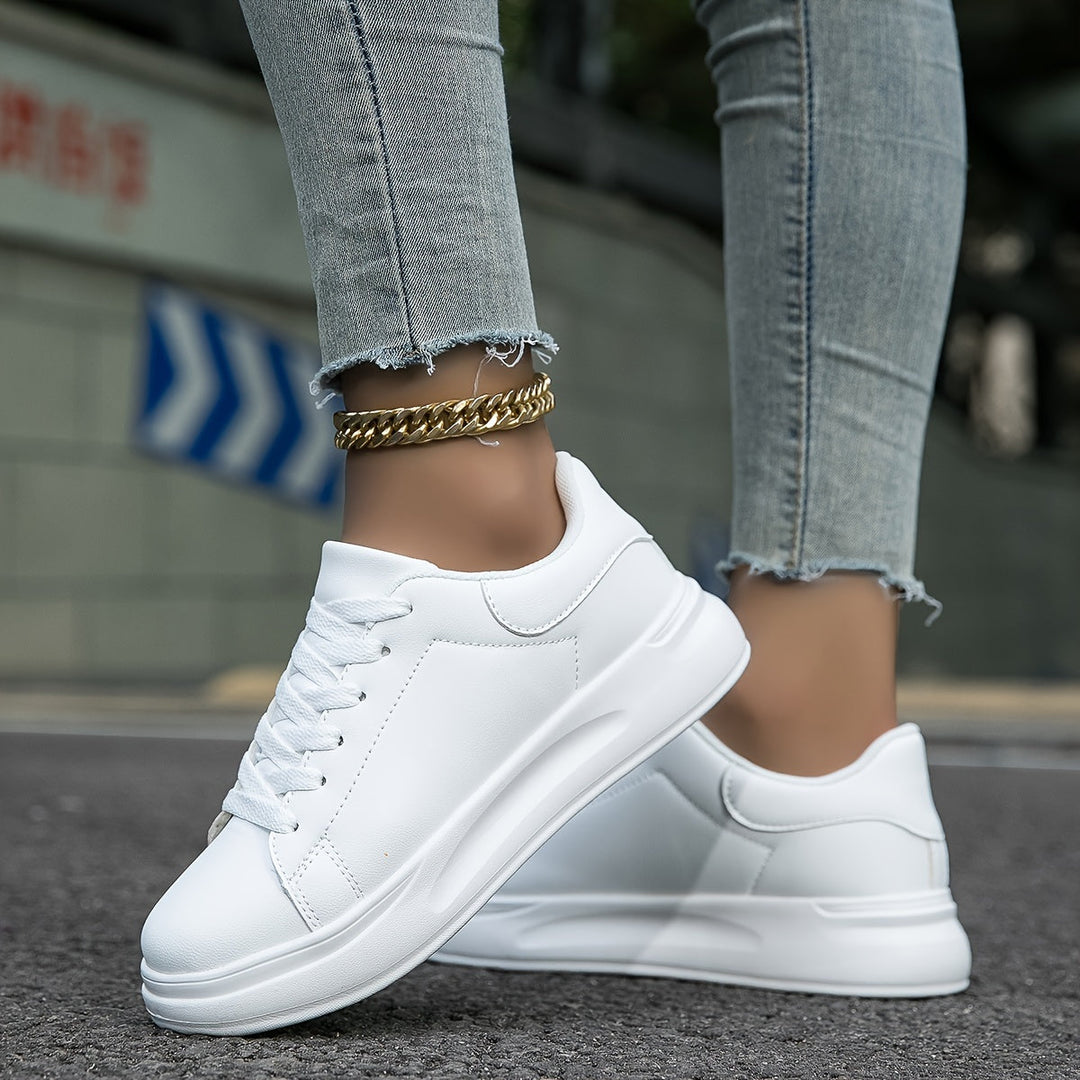 Top view of womens supportive lace-up walking sneakers, designed for superior foot comfort.