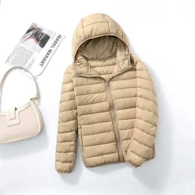 Close-up of lightweight fabric on women's packable puffer jacket, warm and durable.
