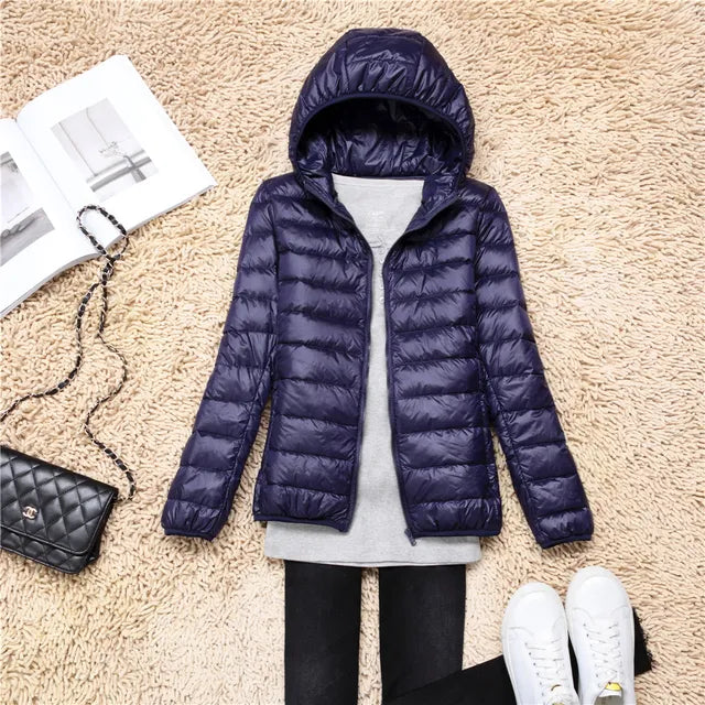Stylish women's casual hooded puffer jacket, lightweight outerwear for fall fashion.